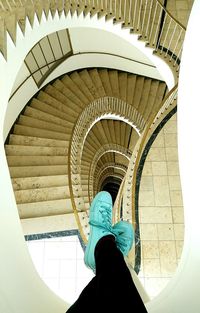 Low section of person against staircase in building