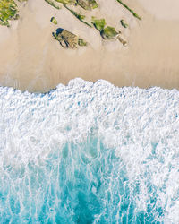 High angle view of surf on beach