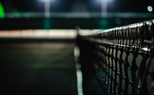 Close-up of railing by fence