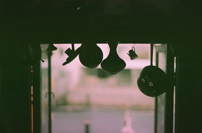 Close-up of cross on glass window