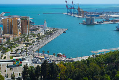 High angle view of buildings by sea