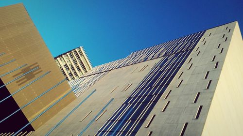 Low angle view of modern building against clear sky