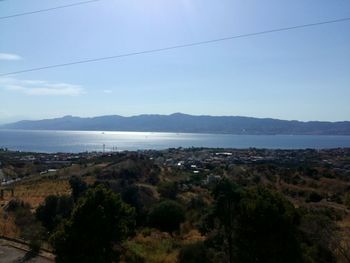 Scenic view of mountains and sea against sky