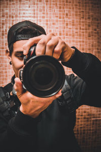 Portrait of man photographing