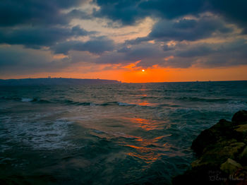 Scenic view of sea against sky during sunset