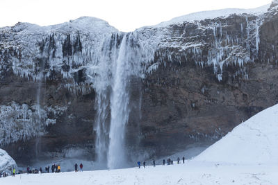 People on snow covered mountain