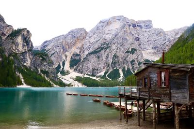 Scenic view of lake and mountains against clear sky