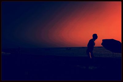 Silhouette of woman at sunset