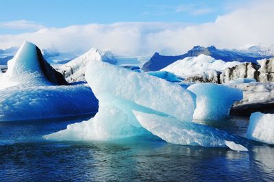 Scenic view of frozen lake against sky