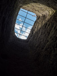 Hole or window with steel bar, sandstone rock formations winterstein, saxony switzerland park. 