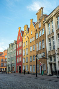 Buildings in city against sky