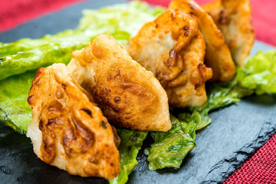 Close-up of fried chicken served on slate