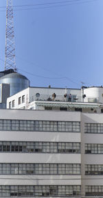 Low angle view of buildings against clear blue sky