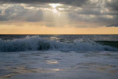 Scenic view of sea against sky during sunset