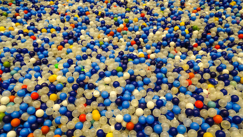 Full frame shot of multi colored balls in swimming pool