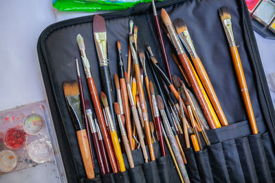 High angle view of paintbrushes on table