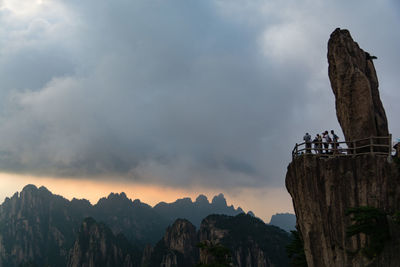 Low angle view of cliff against sky