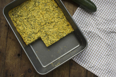 High angle view of zucchini bites in casserole on table