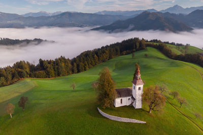 Scenic view of green mountains against sky