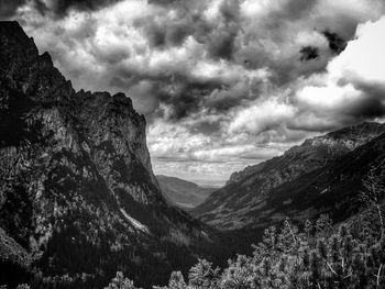 Scenic view of mountains against cloudy sky