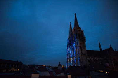 Low angle view of buildings against sky at dusk