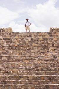 Man on steps against sky