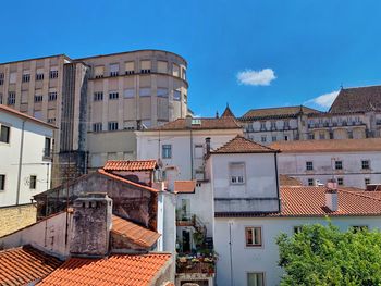 View of buildings against blue sky