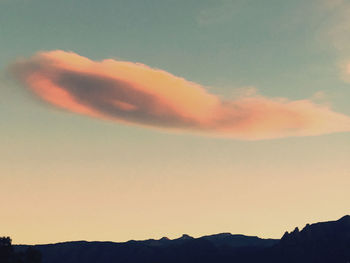 Low angle view of silhouette mountain against sky at sunset