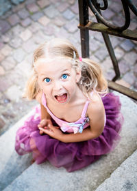 Portrait of smiling girl playing outdoors