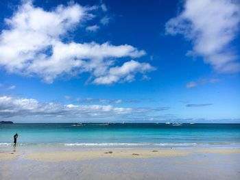 Scenic view of sea against blue sky