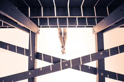 Woman standing on railing