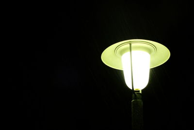 Low angle view of illuminated lamp post