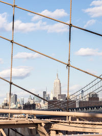 View of bridge and buildings against sky