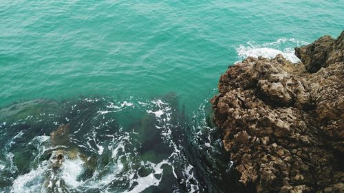 High angle view of rock at sea shore