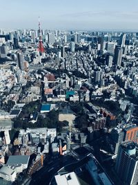 High angle view of modern buildings in city against sky