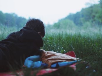 Man relaxing on grassy field