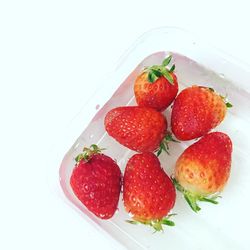 Close-up of strawberry over white background