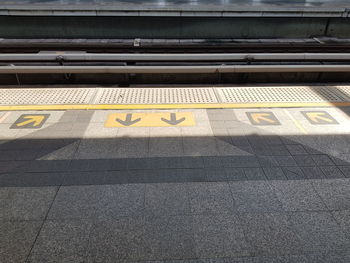 High angle view of text on railroad station platform