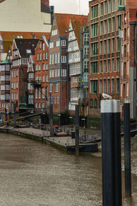 Buildings by street in city