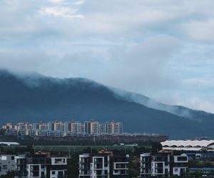 Buildings in city against sky