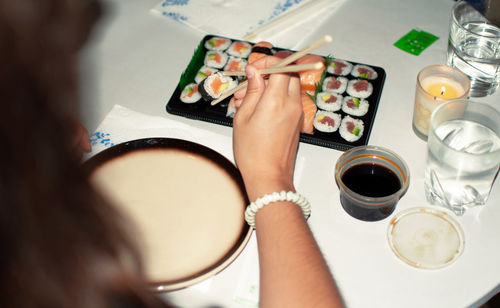 Midsection of woman holding ice cream