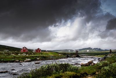 Buildings on land against sky