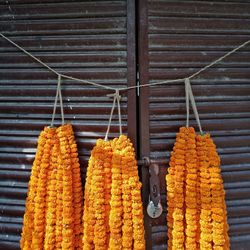 Floral garland hanging from rope for sale