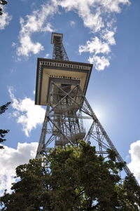 Low angle view of communications tower against sky