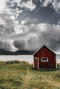 House on field against sky