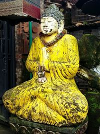 Close-up of yellow statue in store