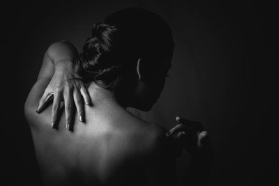 Close-up of woman touching hair