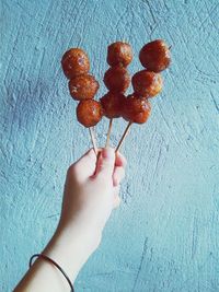 Cropped image of hand holding ice cream