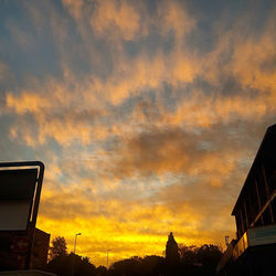 Low angle view of cloudy sky at sunset