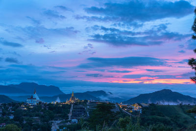 Panoramic shot of townscape against sky during sunset